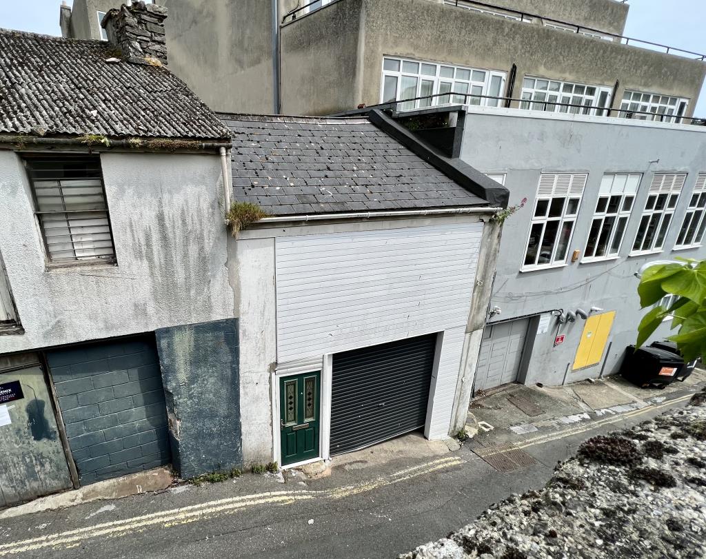 Lot: 47 - COMMERCIAL BUILDING WITH PLANNING PERMISSION GRANTED FOR TWO FLATS TO THE UPPER FLOOR AND FURTHER POTENTIAL - General view of the rear garage and store from Temperance Street